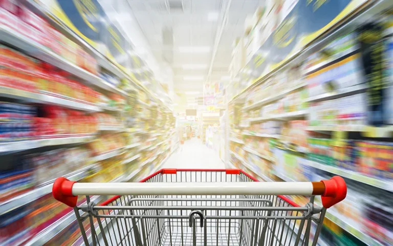 SNAP benefits illustration. Shopping cart in a grocery store aisle